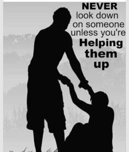 Silouette of A Person Helping Up Another Person
